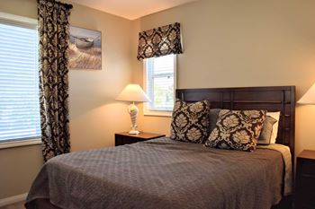 furnished bedroom with large window